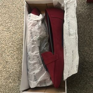 Deep red loafers.